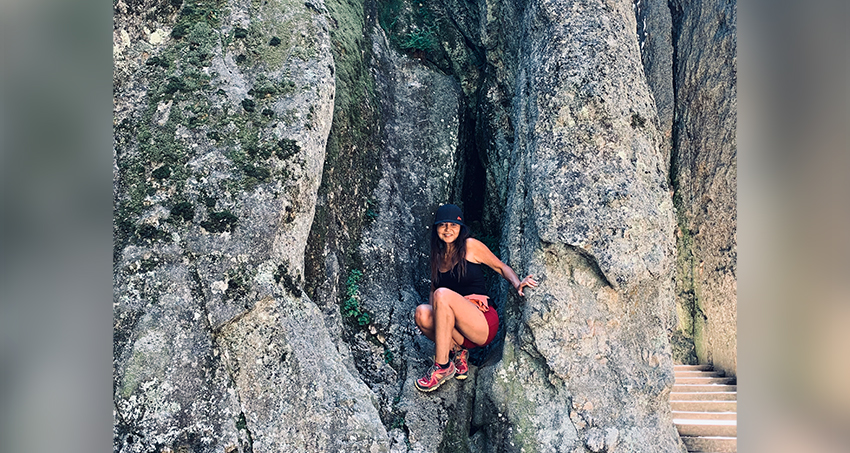 Image of employee Lisa hiking in the mountains