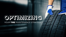 gloved-hands-moving-tire-on-ground